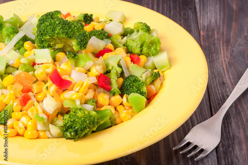 raw vegetable mix on the yellow plate