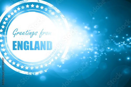 Blue stamp on a glittering background: Greetings from england