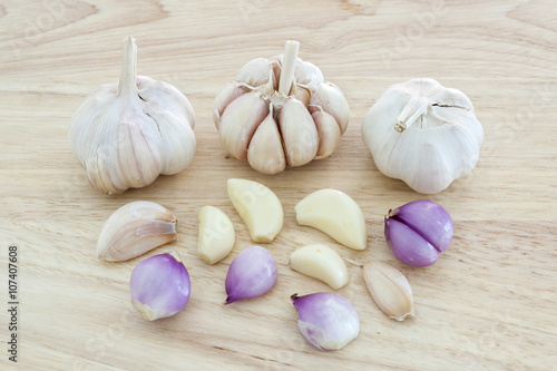  onion and garlic on wooden surface