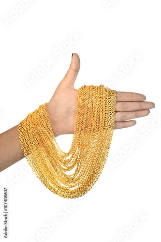 gold necklace on hand