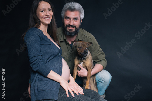 Couple posing with dog