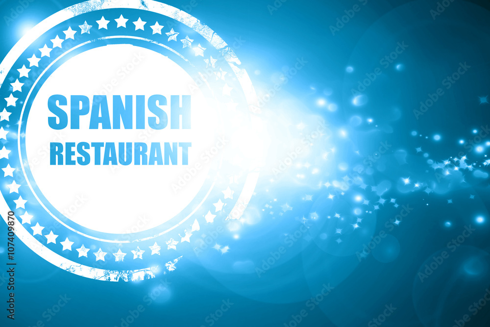 Blue stamp on a glittering background: Delicious spanish cuisine Blue stamp on a glittering background: Delicious spanish cuisine