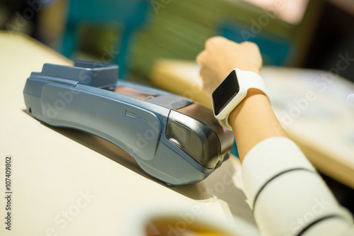 Customer using smart watch to pay
