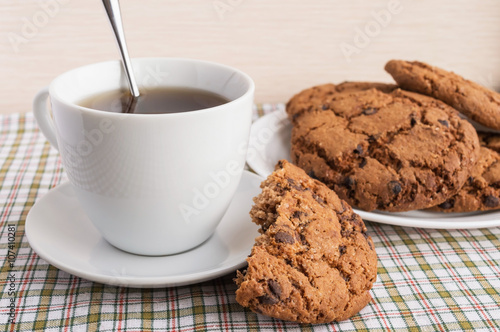 Cup of tea and cookies with chocolate 