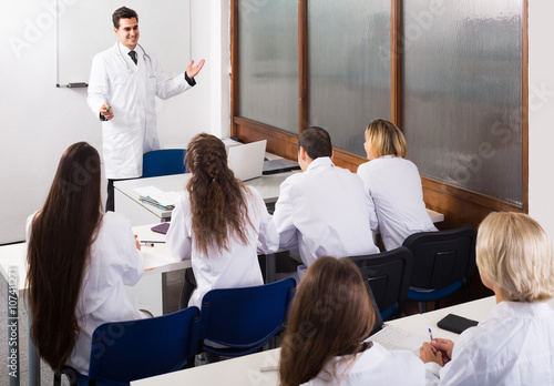 Health-care workers during educational program in school photo