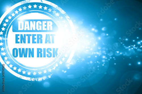 Valokuva Blue stamp on a glittering background: enter at own risk
