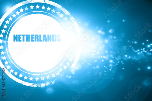 Blue stamp on a glittering background: Greetings from netherland