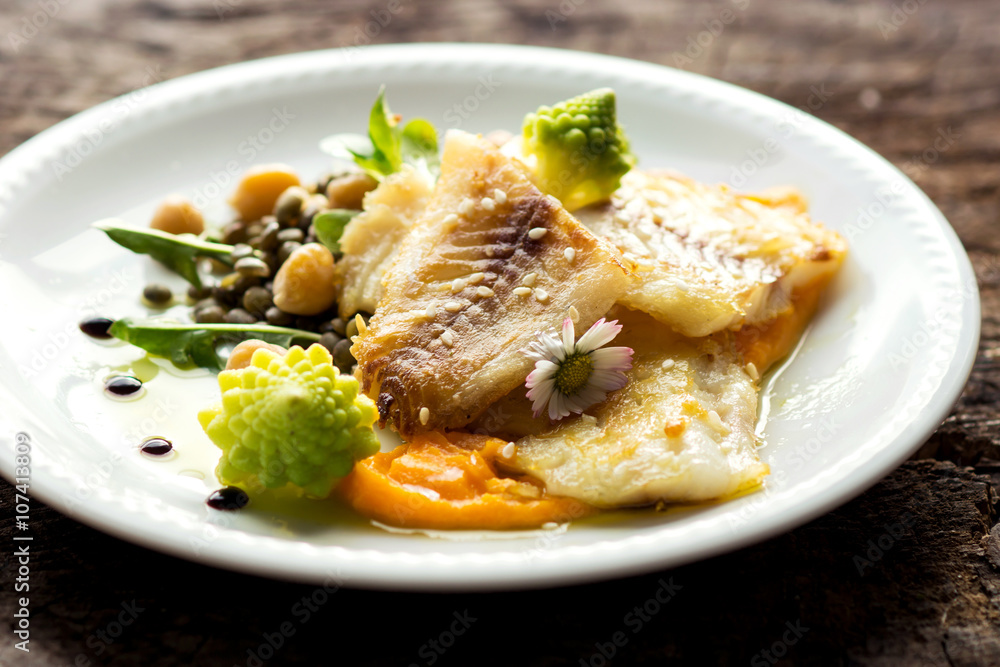 Fish fillet with chickpeas, carrot puree and vegetables Fish fillet with chickpeas, carrot puree and vegetables