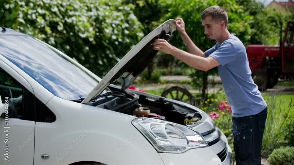 Man open car bonnet and check engine Man open car bonnet and check engine