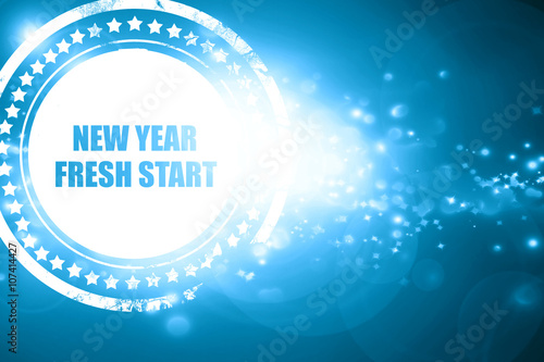 Blue stamp on a glittering background: new year fresh start