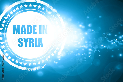 Blue stamp on a glittering background: Made in syria