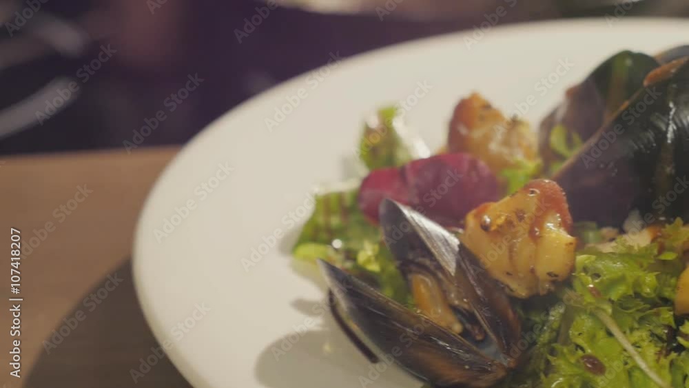 Dressing the salad with seafood and lettuce with sauce Dressing the salad with seafood and lettuce with sauce