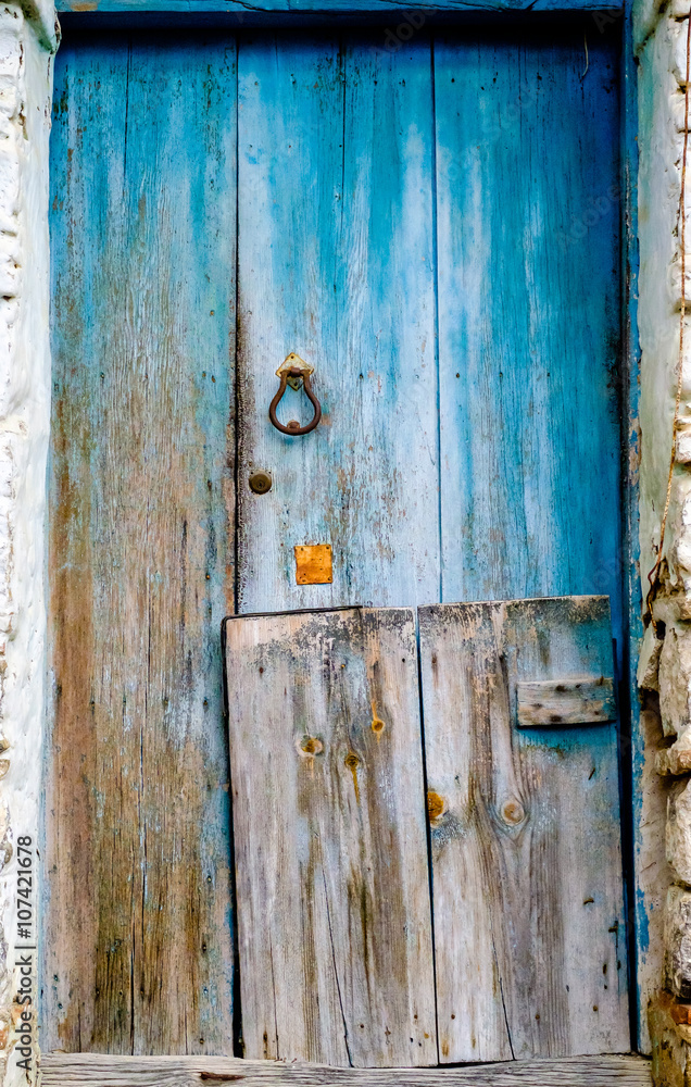 old wooden door with rusty knocker