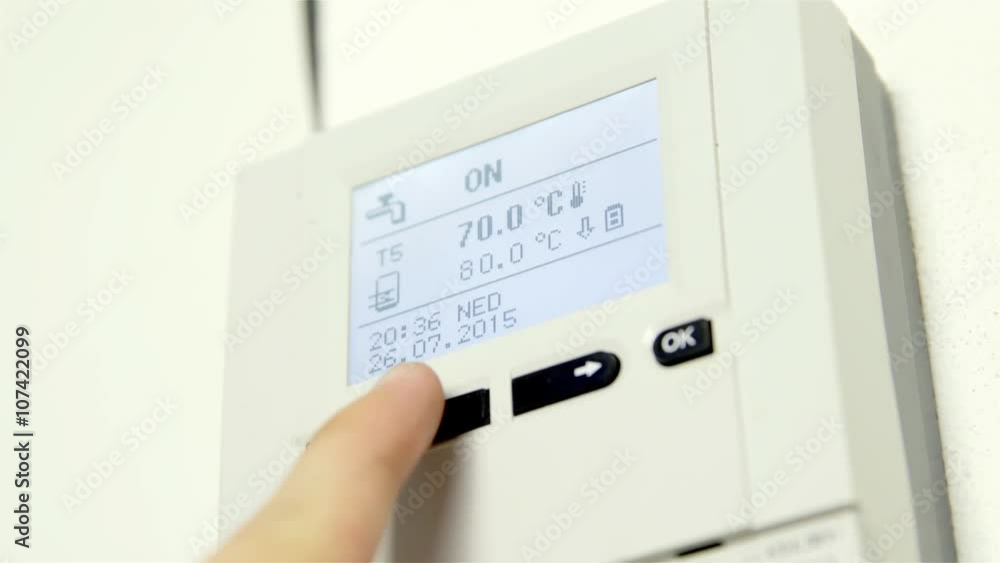 Pushing buttons on temperature status panel Pushing buttons on temperature status panel
