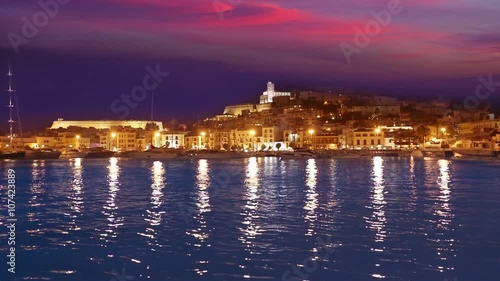 Ibiza Eivissa town sunset with city lights reflection in Mediterranean sea of balearic Islands of Spain