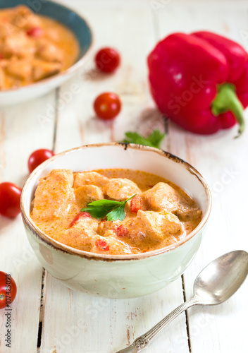 Delicious chicken stew with paprika in a bowl