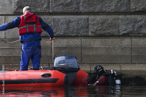 diver is sinking into river