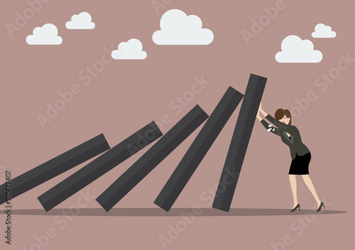 Business woman pushing hard against falling deck of domino tiles