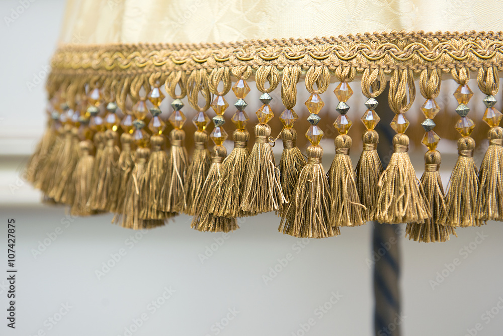 Fototapeta the tassels and beads beige floor lamp