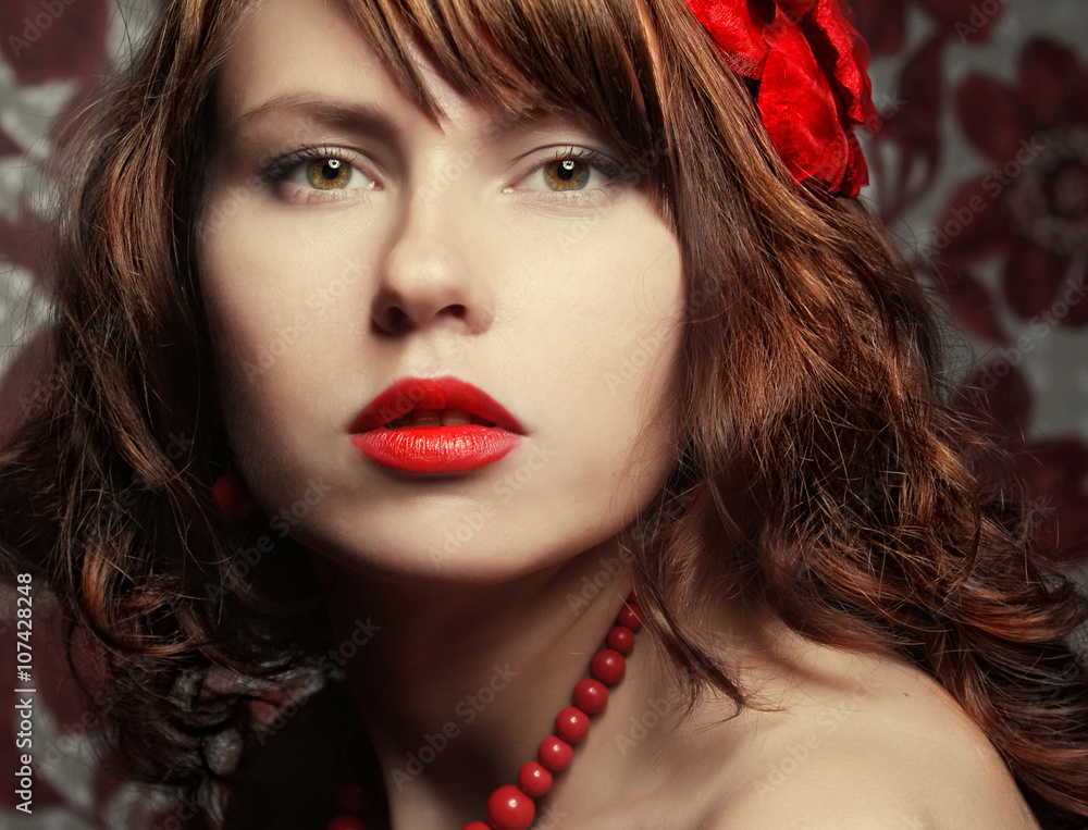 Fototapeta premium beautiful girl with red flower in hair 