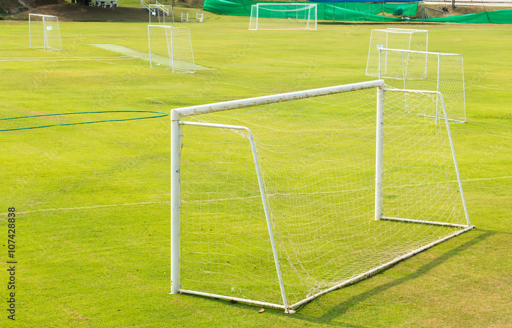 Fototapeta premium A view of a net on a vacant soccer pitch.
