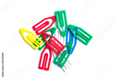 Multi-colored paper clips on a white background.