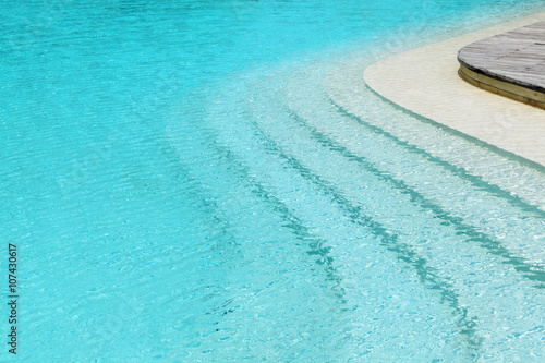curved steps in swimming pool at the resort