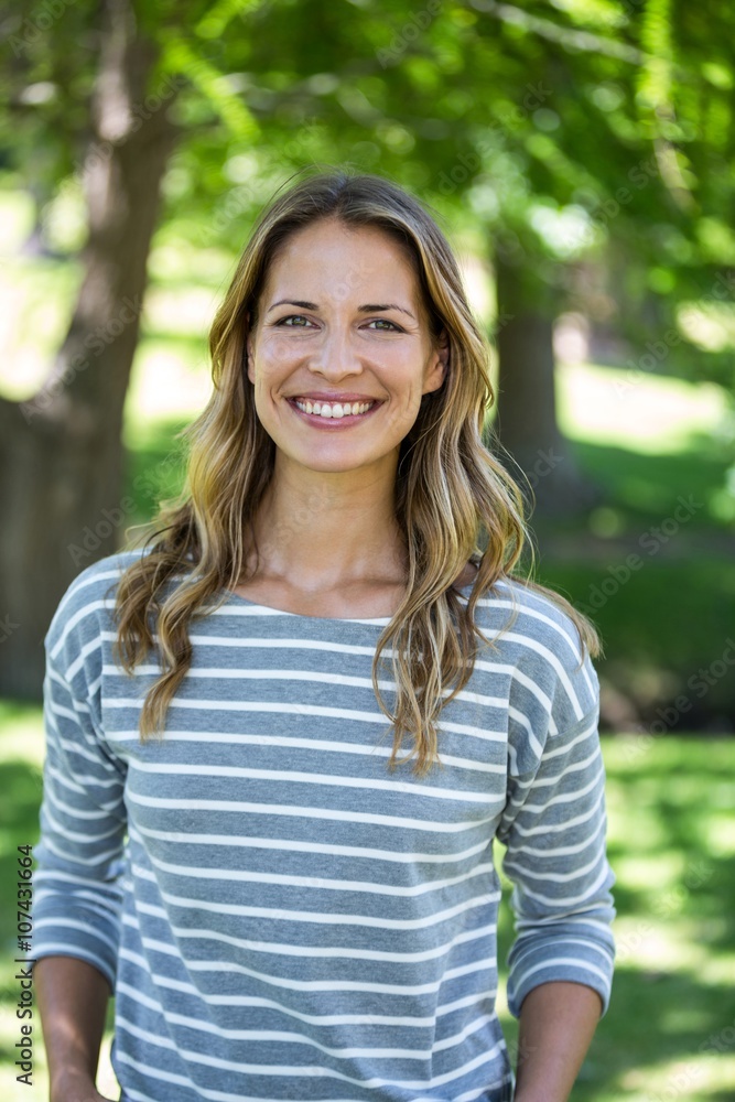 Portrait of a smiling woman in a park Portrait of a smiling woman in a park