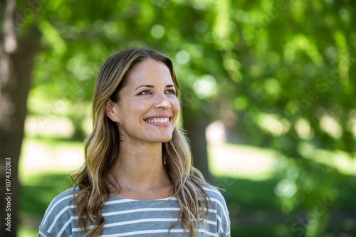 Portrait of a smiling woman in a park
