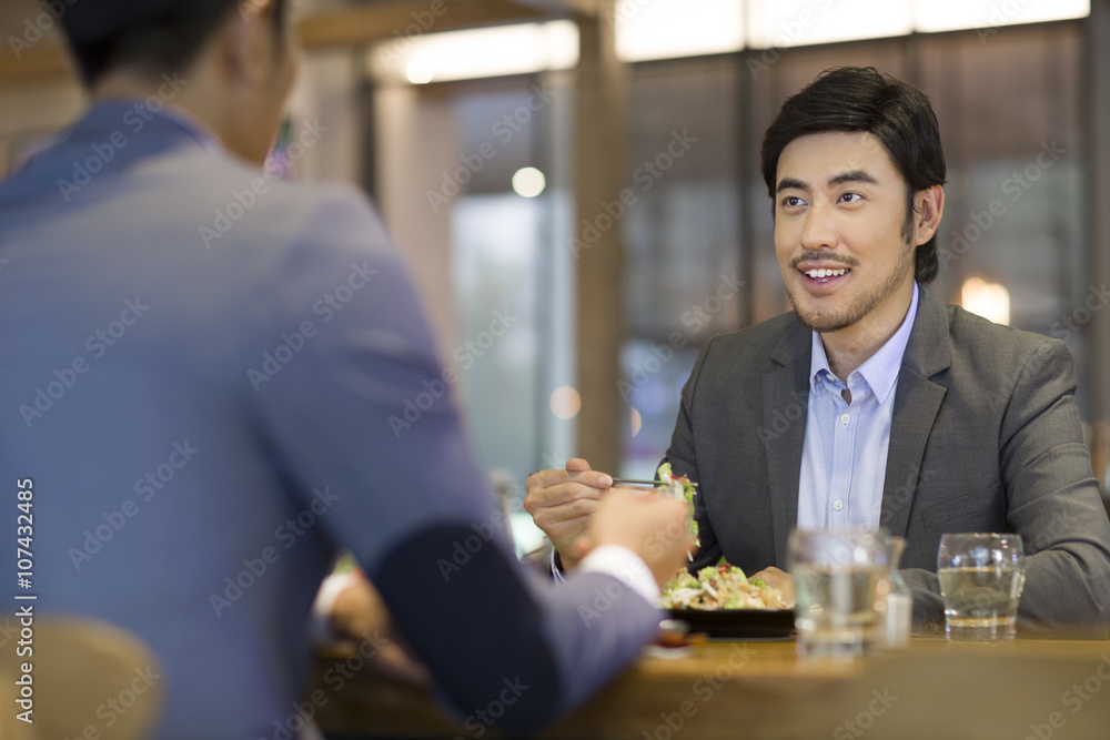 Businessmen having dinner together