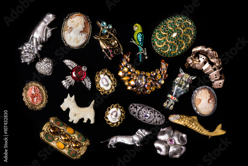 Antique and vintage jewelry collection isolated on a black background