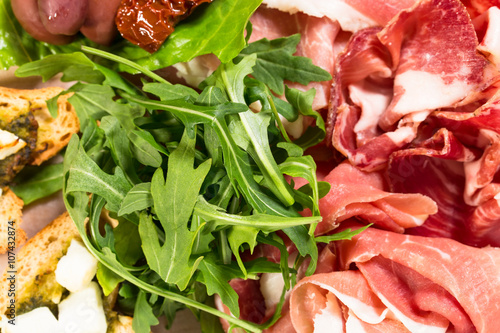 Traditional tuscan antipasto platter closeup.