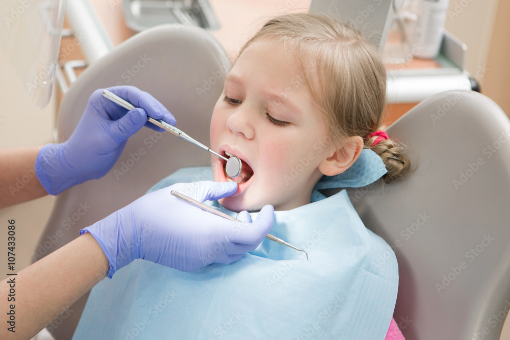 Fototapeta premium Young girl at dentist., dental treatment