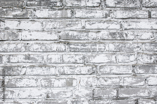 Grunge white gray brick wall background.