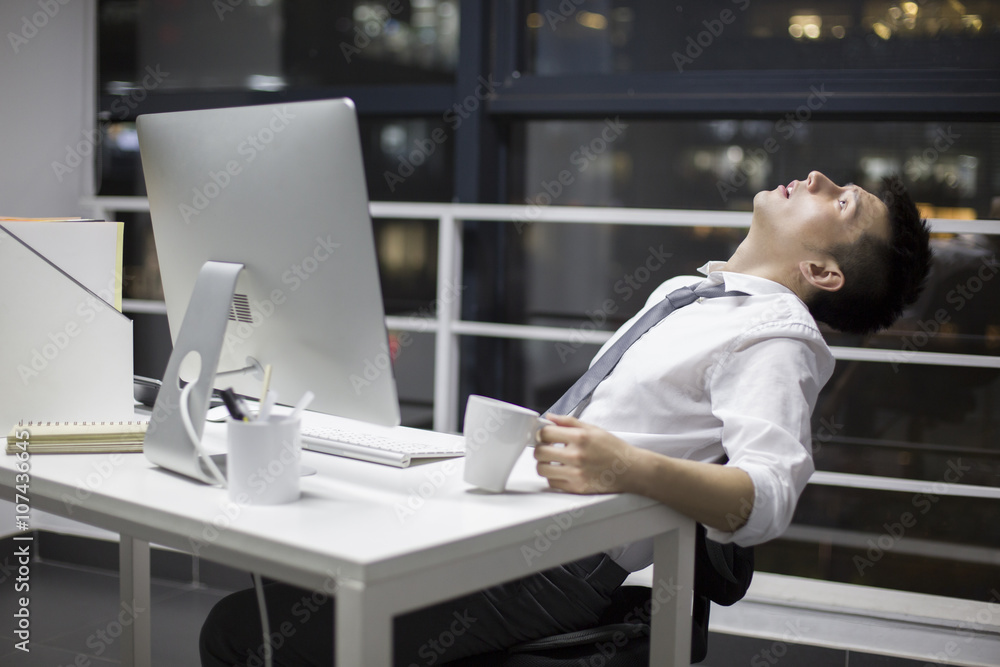 Businessman working late in office Businessman working late in office