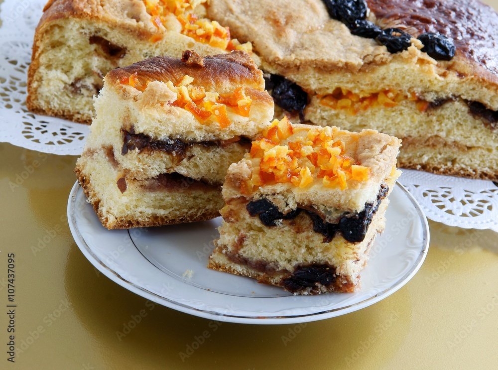 sweet bun with almonds ,cherries and orange skin sweet bun with almonds ,cherries and orange skin