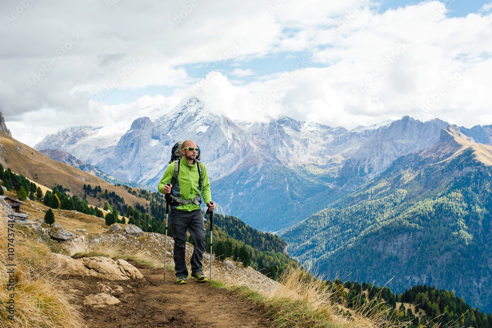 Fototapeta premium Man tourist walking the mountains with a backpack.