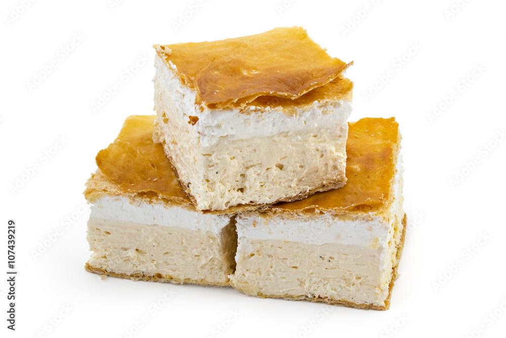 Three peaces of delicious Serbian sweet cream pie, krempita on white background