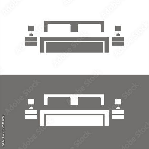 Icono de cama doble sobre fondos blanco y negro. Mobiliario de dormitorio