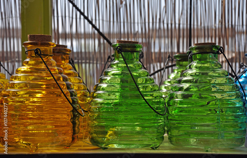 Fototapeta Naklejka Na Ścianę i Meble -  Green and orange glass bottles