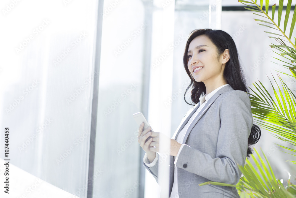 Businesswoman with a smart phone Businesswoman with a smart phone