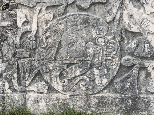 skulls sculpture detail in chichen itza mexico photo