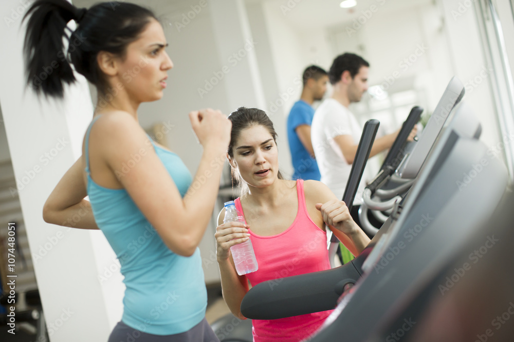 Young people training in the gym Young people training in the gym