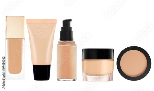 liquid makeup foundation in bottle and face powder isolated on w photo