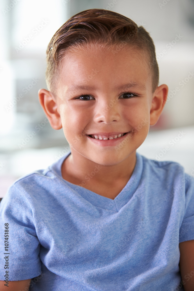 Head And Shoulders Portrait Of Smiling Hispanic Boy At Home Head And Shoulders Portrait Of Smiling Hispanic Boy At Home
