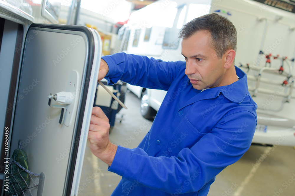 Mechanic working on camper van Mechanic working on camper van