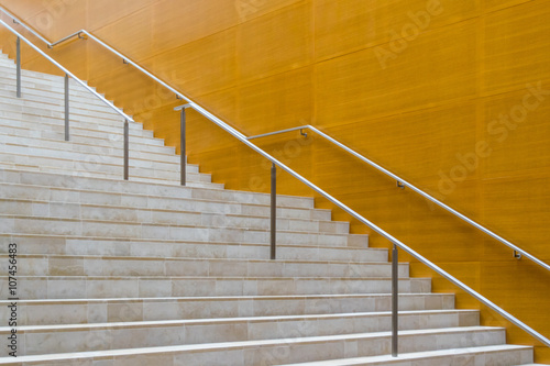 Details of metal railing and marble stairs of modern building
