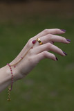 Female hand with oriental bracelet and ring
