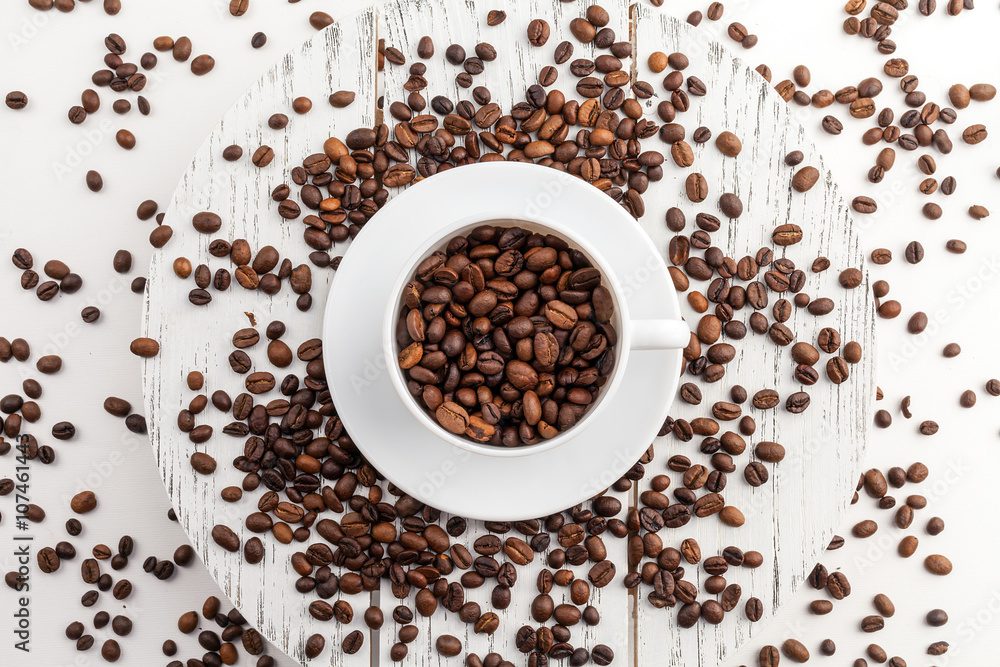 Coffee cup and beans on a white background. Coffee cup and beans on a white background.
