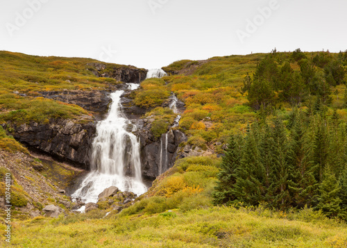 Waterfall in Skutulsfjordur.  A waterfall located in the fjord of Skutulsfjordur a short distance from the town of Isafjordur in North West Iceland.